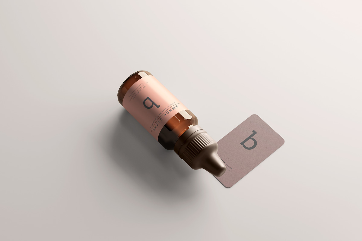 Amber Glass Dropper Bottle Mockups, a Cups & Container Mockup by pmvch (Photo 17 of 20)