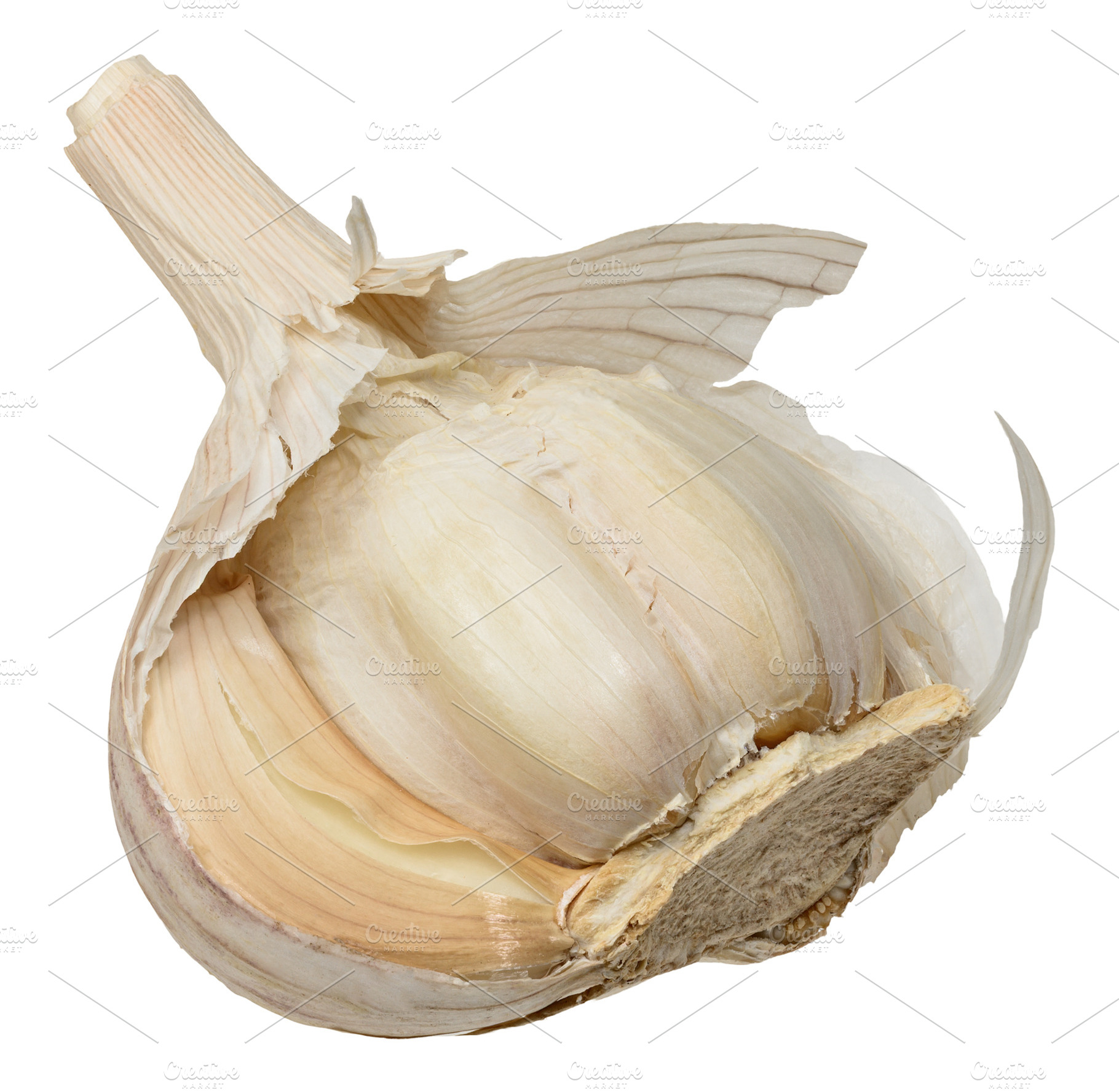 Clove of garlic in a dry beige peel, isolated on a background. C, a Food & Drink Photo by ndanko