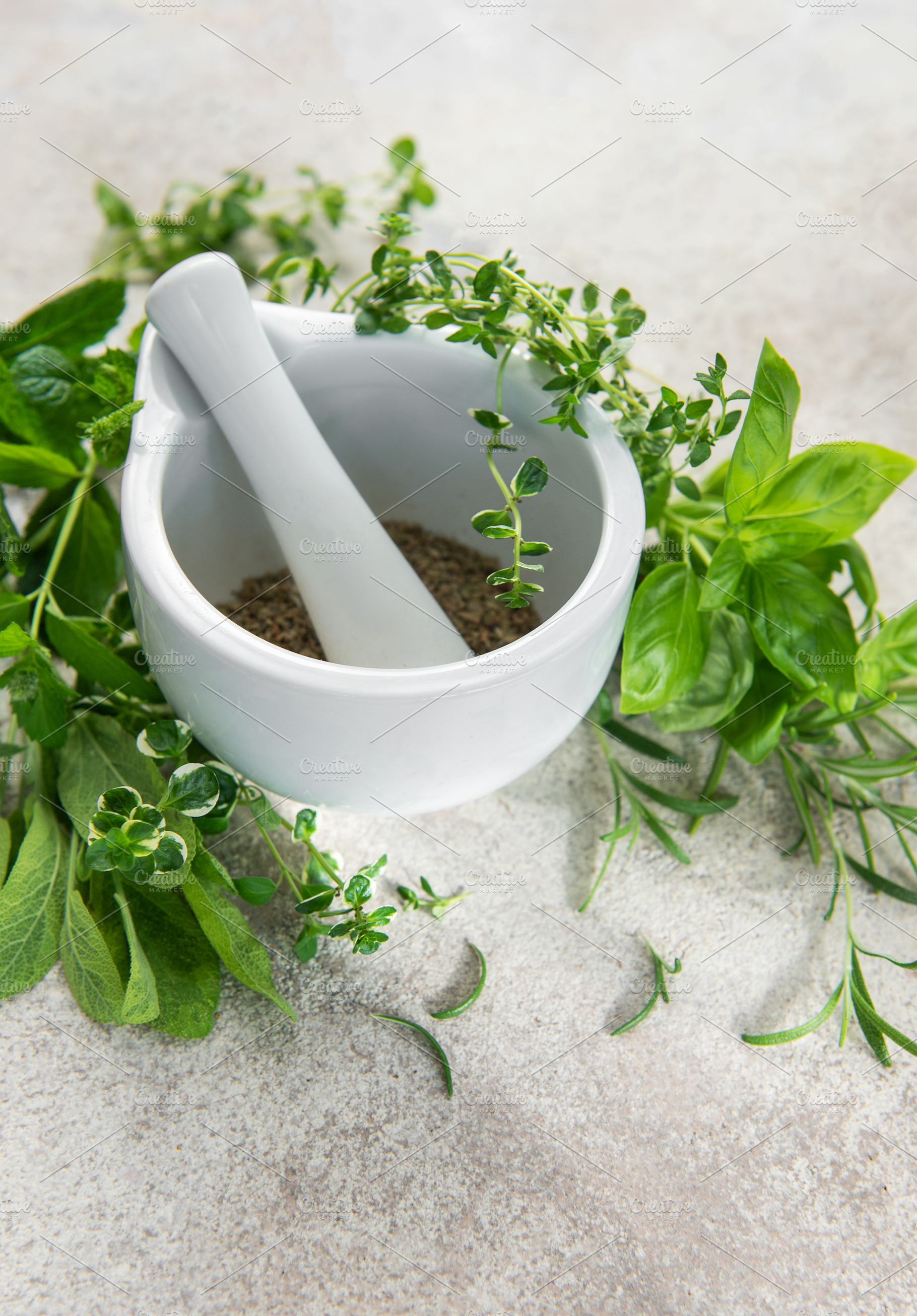 Mortar and pestle grinding fresh herbs for wellness, a Food & Drink Photo by Olena Rudo