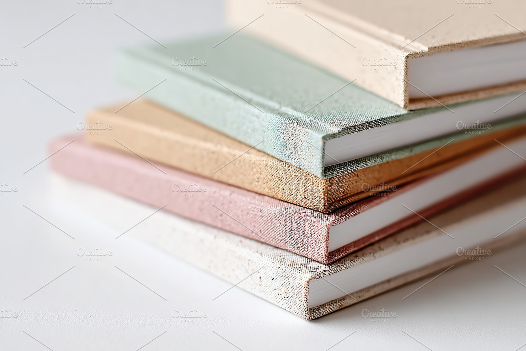 Stacked collection of pastel colored notebooks arranged neatly in a top-down vi, a Photo by AlyaAnd