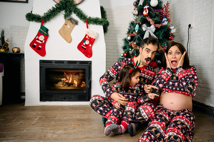 Family wearing matching Christmas pajamas, a Holiday Photo by YossSabalet