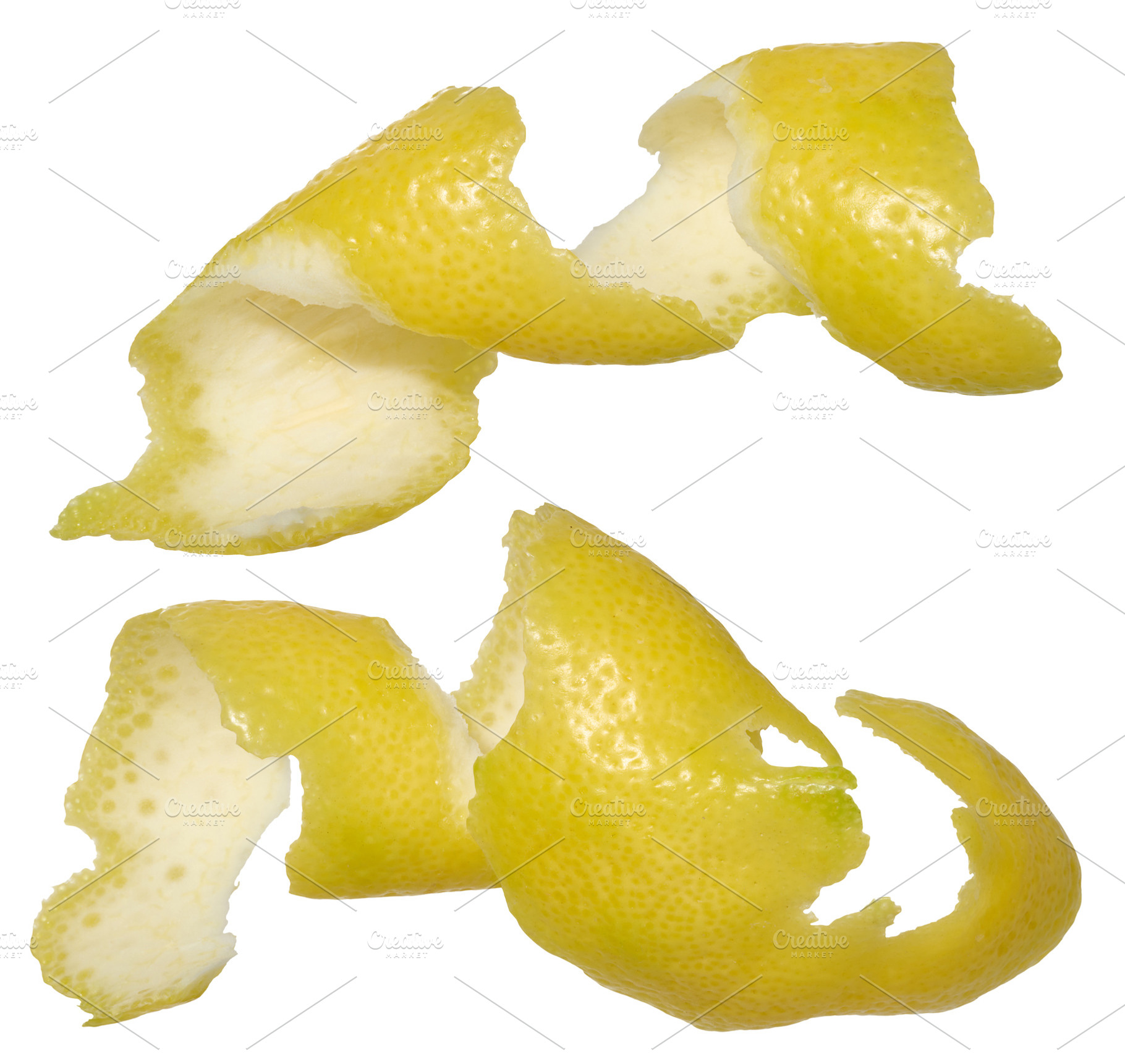 Two twisted strips of lemon peel showing the bright yellow outsi, a Food & Drink Photo by ndanko