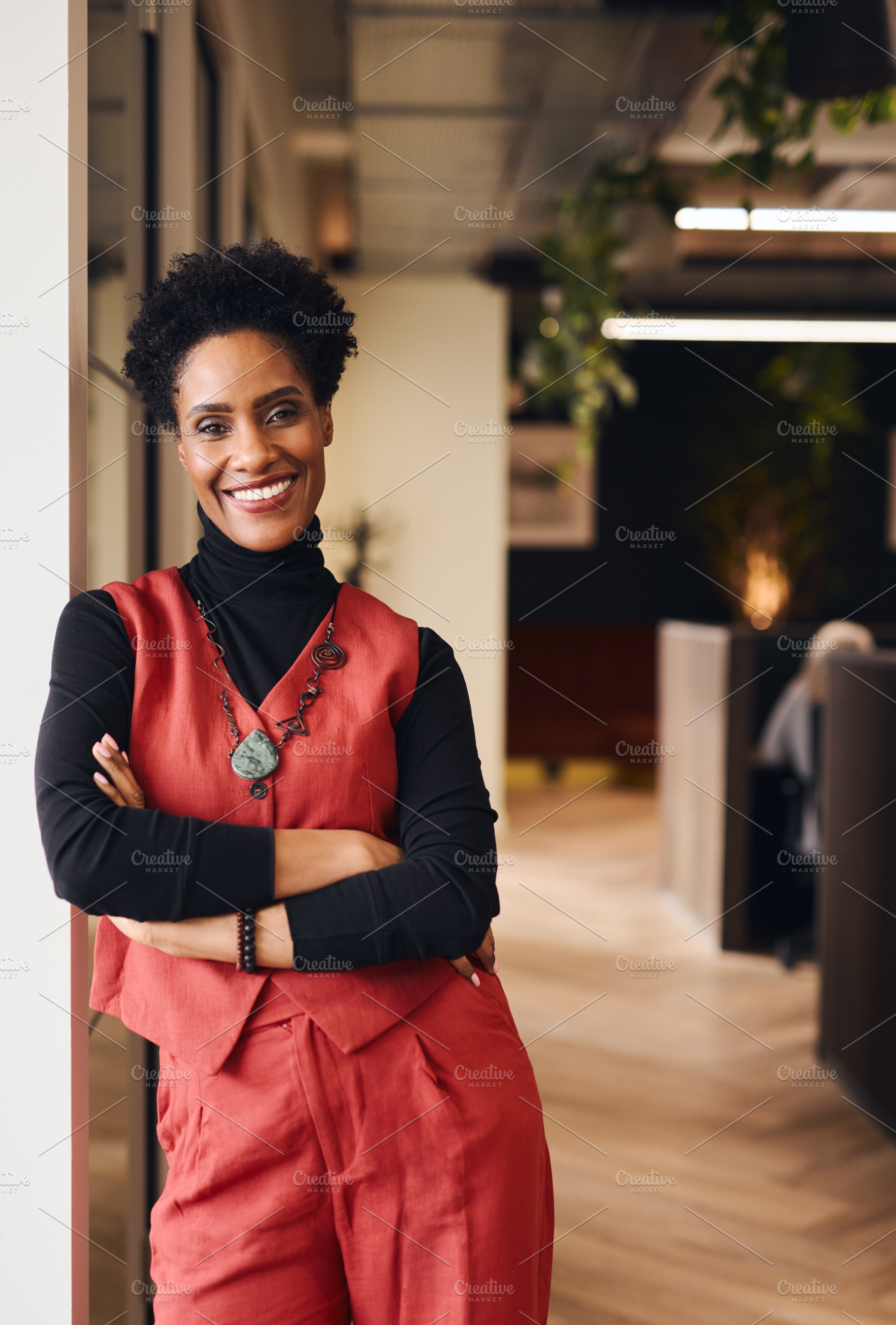 Portrait of confident mature black woman smiling and looking at camera in offic, a Technology Photo by Southworks
