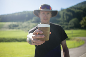 Handsome young man drinks coffee at containing nature, cup, and holding