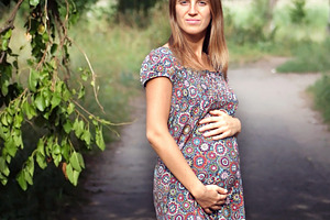 pregnant woman in the park, a Photo by saiko3p