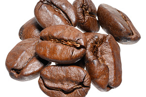 Roasted coffee beans, shot close-up on an isolated background, a Food & Drink Photo by ndanko