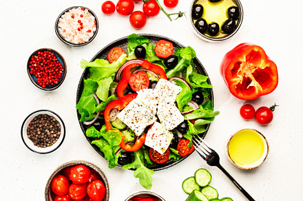 Greek salad with feta cheese, olives, cherry tomato, paprika, cu, a Food & Drink Photo by 5PH