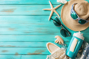 Beach essentials including sunglasse, a Photo by Pavel_design