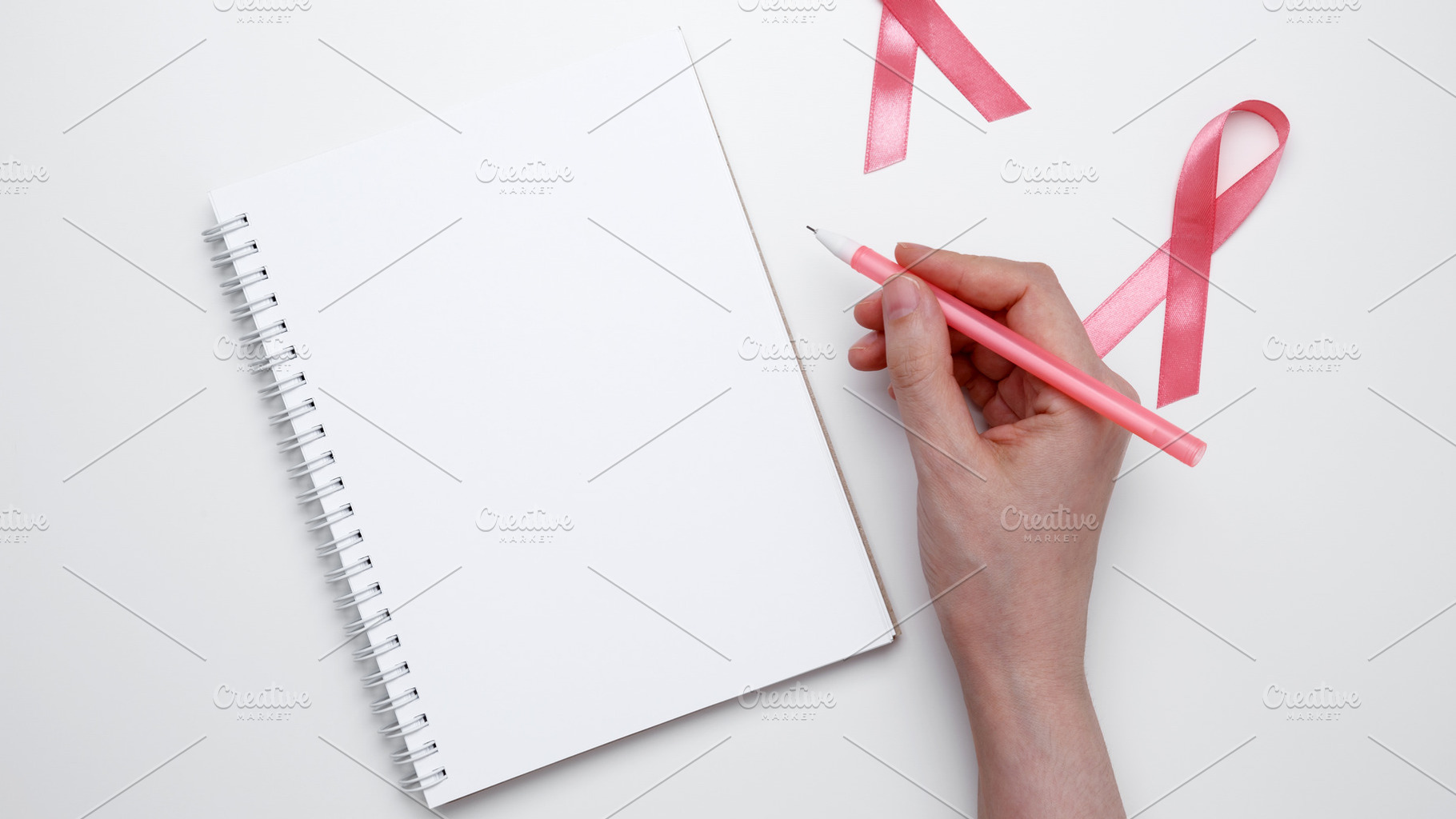 Symbolizing breast cancer awareness. Woman scheduling preventive checkup with v, a Photo by matucha