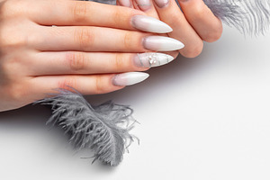 Woman's hands creating delicate feather nail art design, a Beauty & Fashion Photo by Olena Rudo