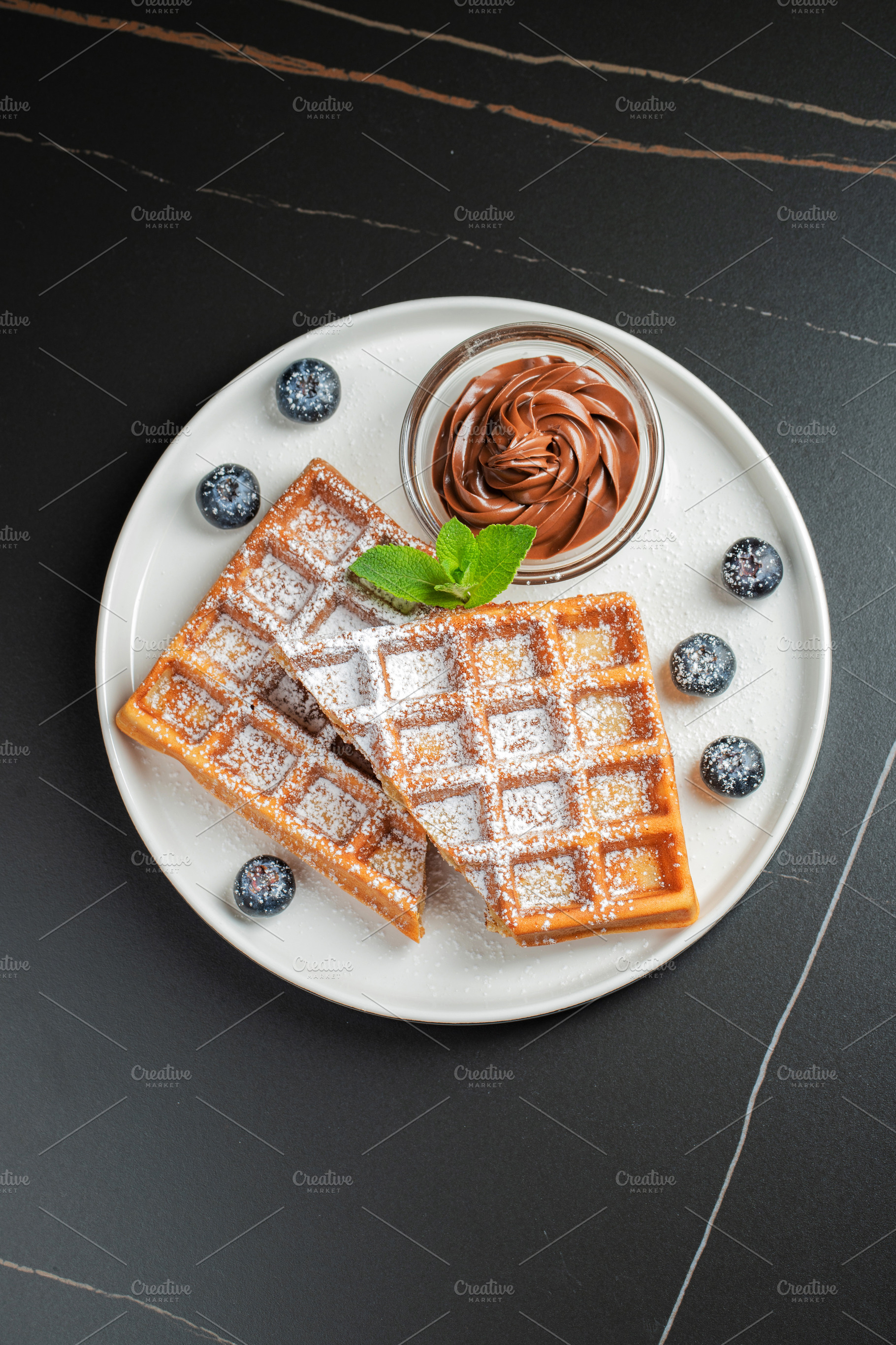 Belgium waffles Homemade waffles with strawberries, a Food & Drink Photo by Budarinphoto