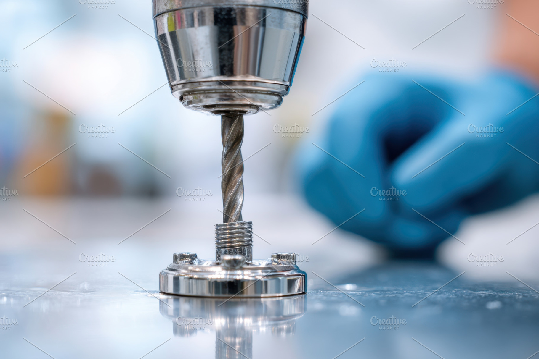 Modern drill drilling into a metal surface, an Industrial Photo by AlyaAnd