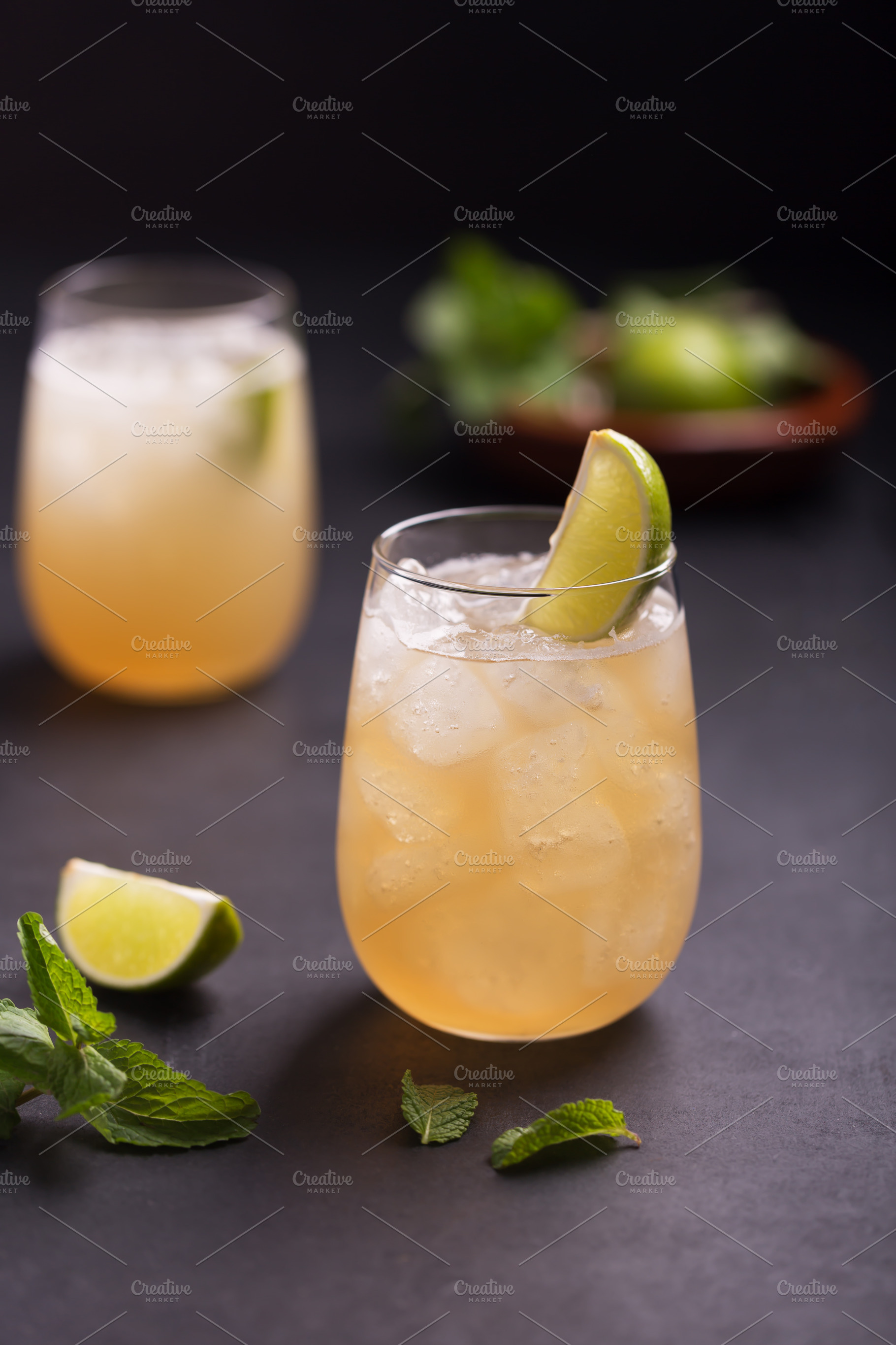 Fresh cocktail prepared with ginger beer, lime, mint and ice, a Food & Drink Photo by zakiroff