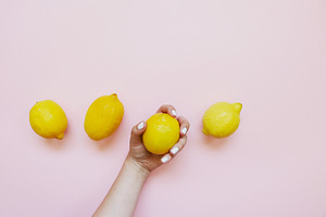 Manicure Hand Holding Lemon Fruit