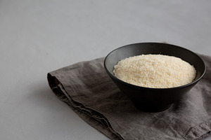 Organic Parmigiano Reggiano Parmesan Cheese Grated in a Bowl, si, a Food & Drink Photo by LiudmylaChuhunova