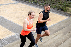 Man and woman running up outdoor stairs during workout, a Sports & Recreation Photo by etorres69