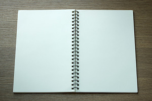 Open spiral notebook stock photo containing notebook and paper