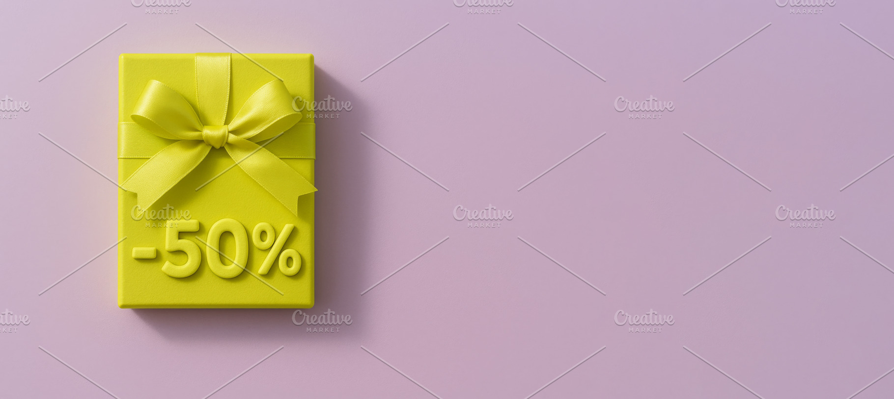 Yellow gift box with ribbon and 50 percent sign on pastel pink b, a Photo by Dvoevnore photos