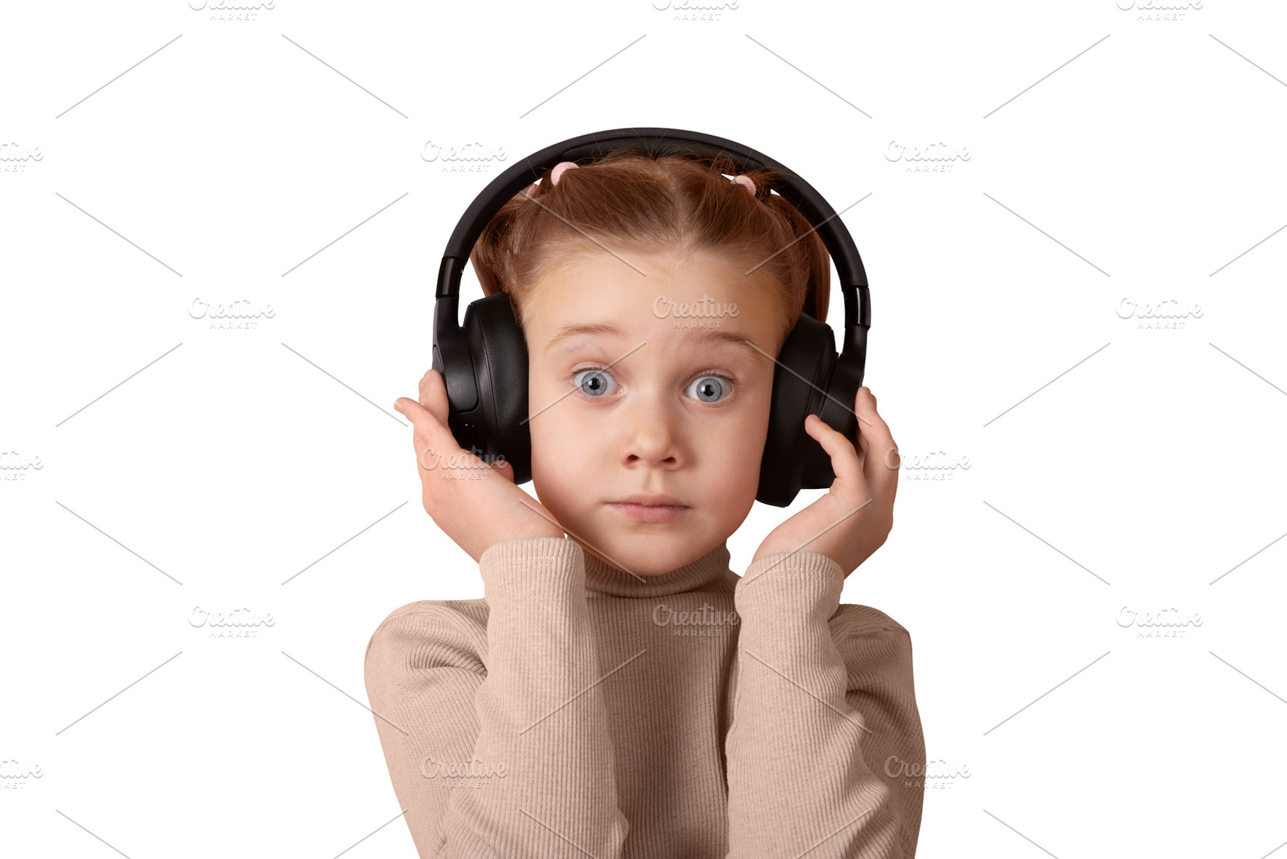 Young girl with headphones, looking surprised. Isolated on white, a Person Photo by Ales Munt