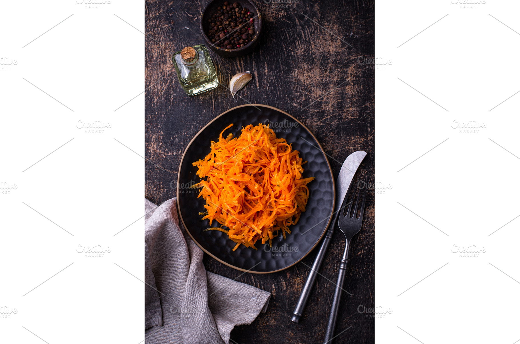 Spicy korean carrot salad in plate, a Food & Drink Photo by Yulia Furman