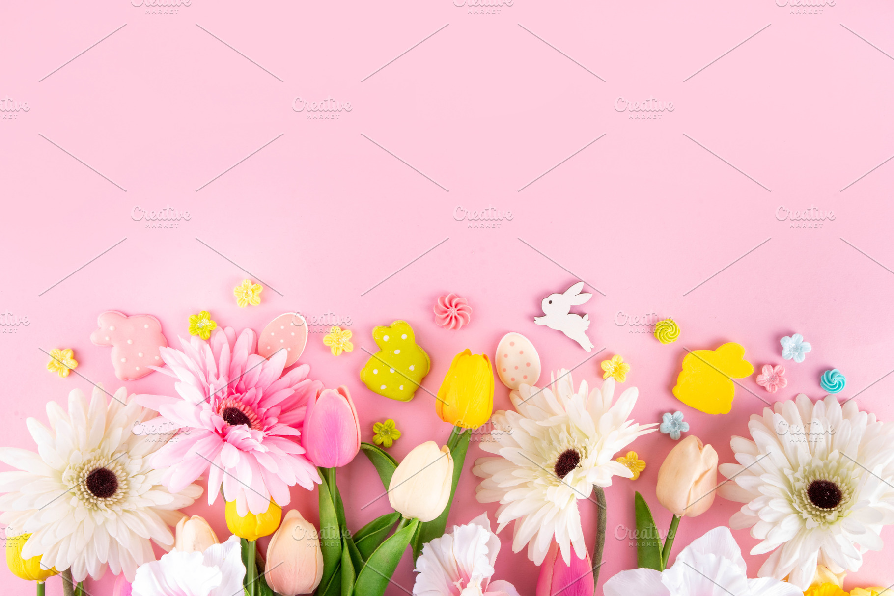 Beautiful spring flowers bouquet with Easter decorations on pink, a Holiday Photo by Rimma