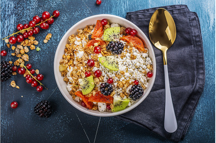 Cottage cheese with granola, berries, a Food & Drink Photo by Ekaterina_Markelova