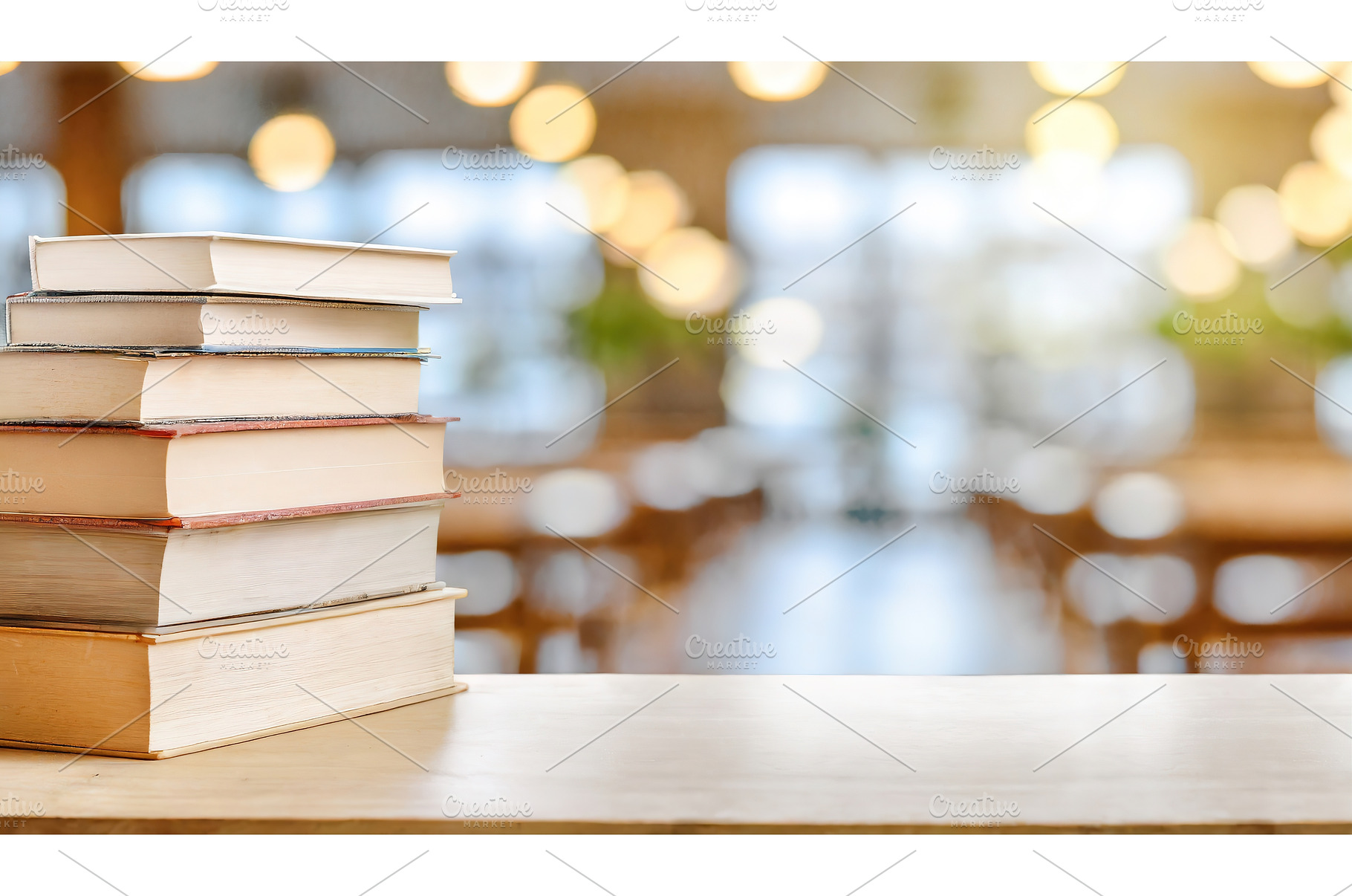 Stack of books on a desk in a softly, a School & Education Photo by Igor Tichonow