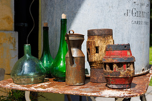 Vintage still life with green glass bottles, a Food & Drink Photo by Bepslabor