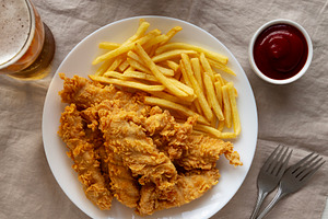 Homemade Chicken Strips with Fries on a Plate, top view. Flat la, a Food & Drink Photo by LiudmylaChuhunova