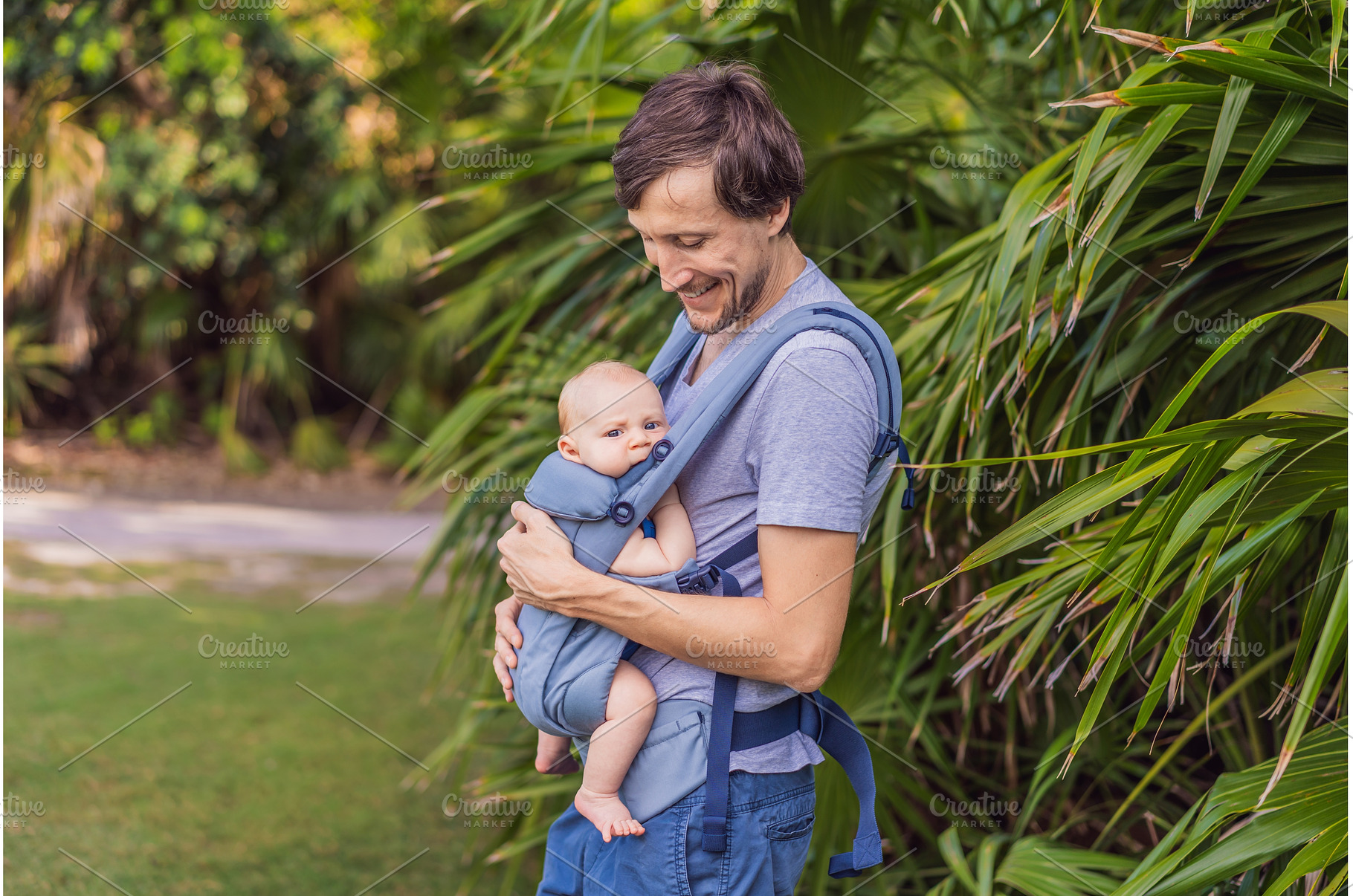 Young father walks in nature with, a Person Photo by Elizaveta Galitskaya