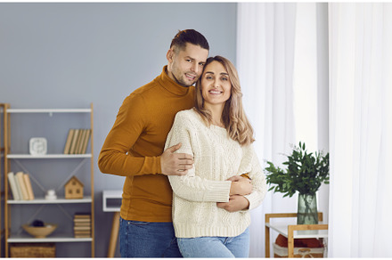 Happy smiling young couple standing, a Person Photo by StudioRomantic