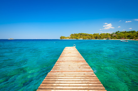 Pier at sea in the summertime, a Nature Photo by Landscape and travel