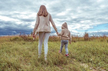 Woman mother walks with the child featuring emotion, playful, and day
