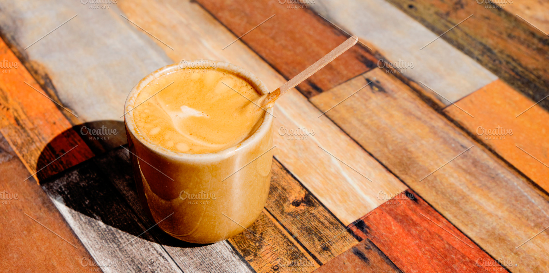 cup with french noisette on a table, banner format, a Photo by Nito