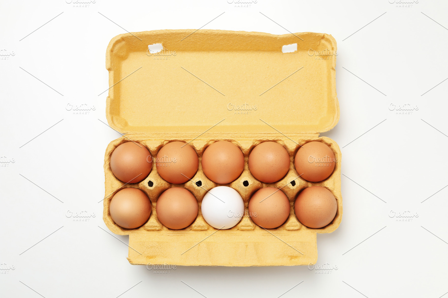 Egg box with eggs on white background, top view, a Food & Drink Photo by AtlasStudio PRO