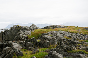 Scenic Icelandic coast with rocky terrain and distant mountains under cloudy sk, a Nature Photo by AS photostudio