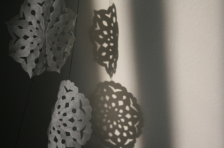 Paper snowflake detail containing paper, paper cut, and snowflake
