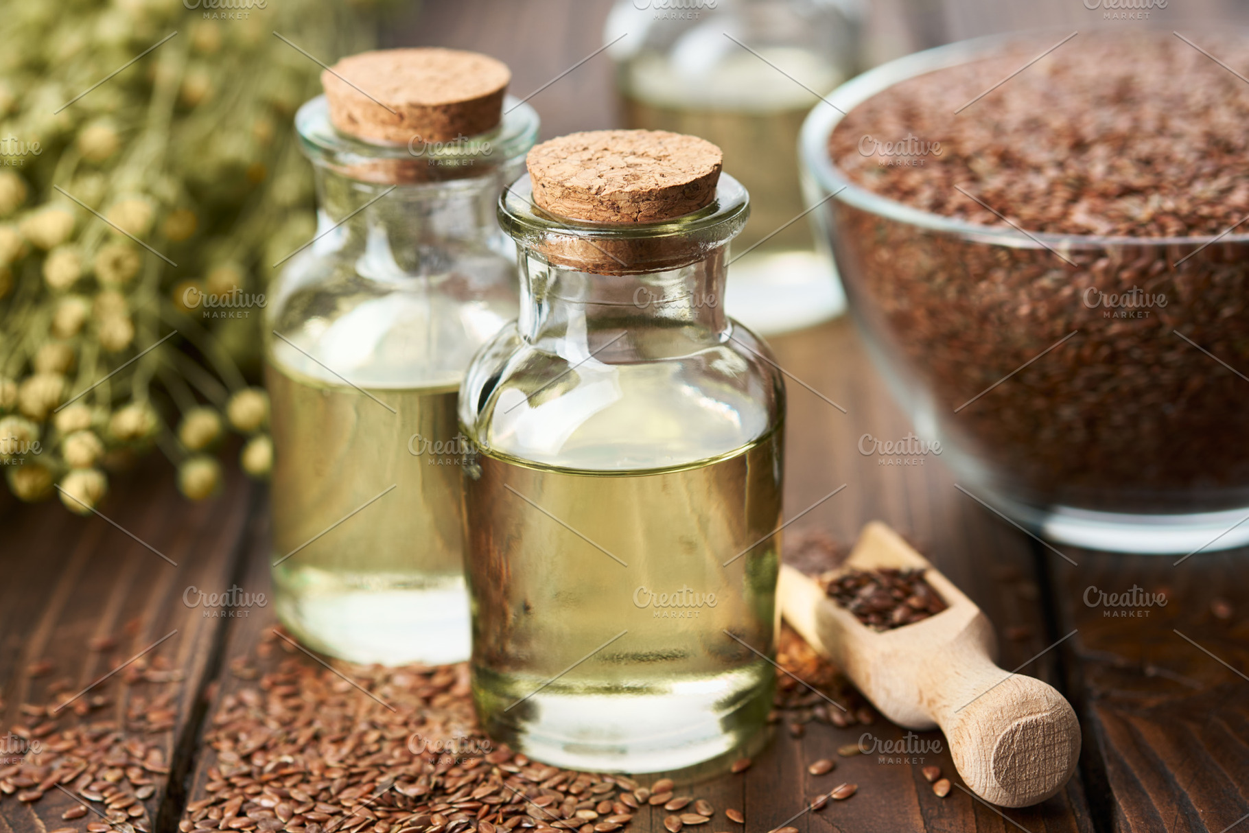 Bottles of linseed oil, flax seeds, a Food & Drink Photo by chamillewhite