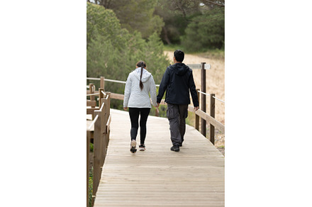 A man and woman are walking on a