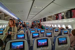 Interior of airplane cabin with before flying, a Transportation Photo by DanFLCreativo