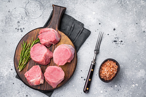Beautifully cut raw pork medallions for tenderloin meat, waiting, a Food & Drink Photo by composter-box@mail.ru