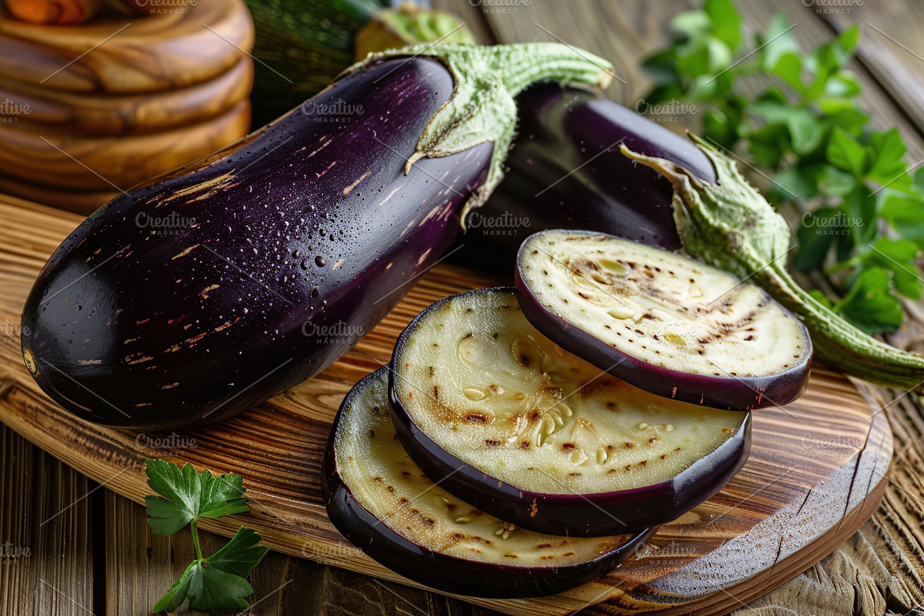 Fresh pieces of eggplant on wooden background, a Photo by AlyaAnd