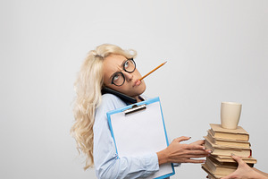 Overload and workplace inequality. Female boss loading busy businesswoman in gl, a Photo by Prostock-Studio