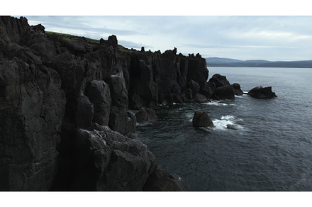 Top view of black rocks with blue, a Nature Photo by Media Whale Stock