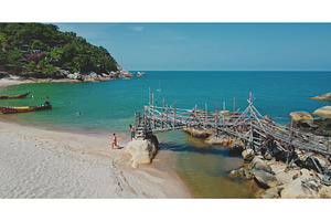 Tourists walking on tropical beach, a Nature Photo by Goinyk