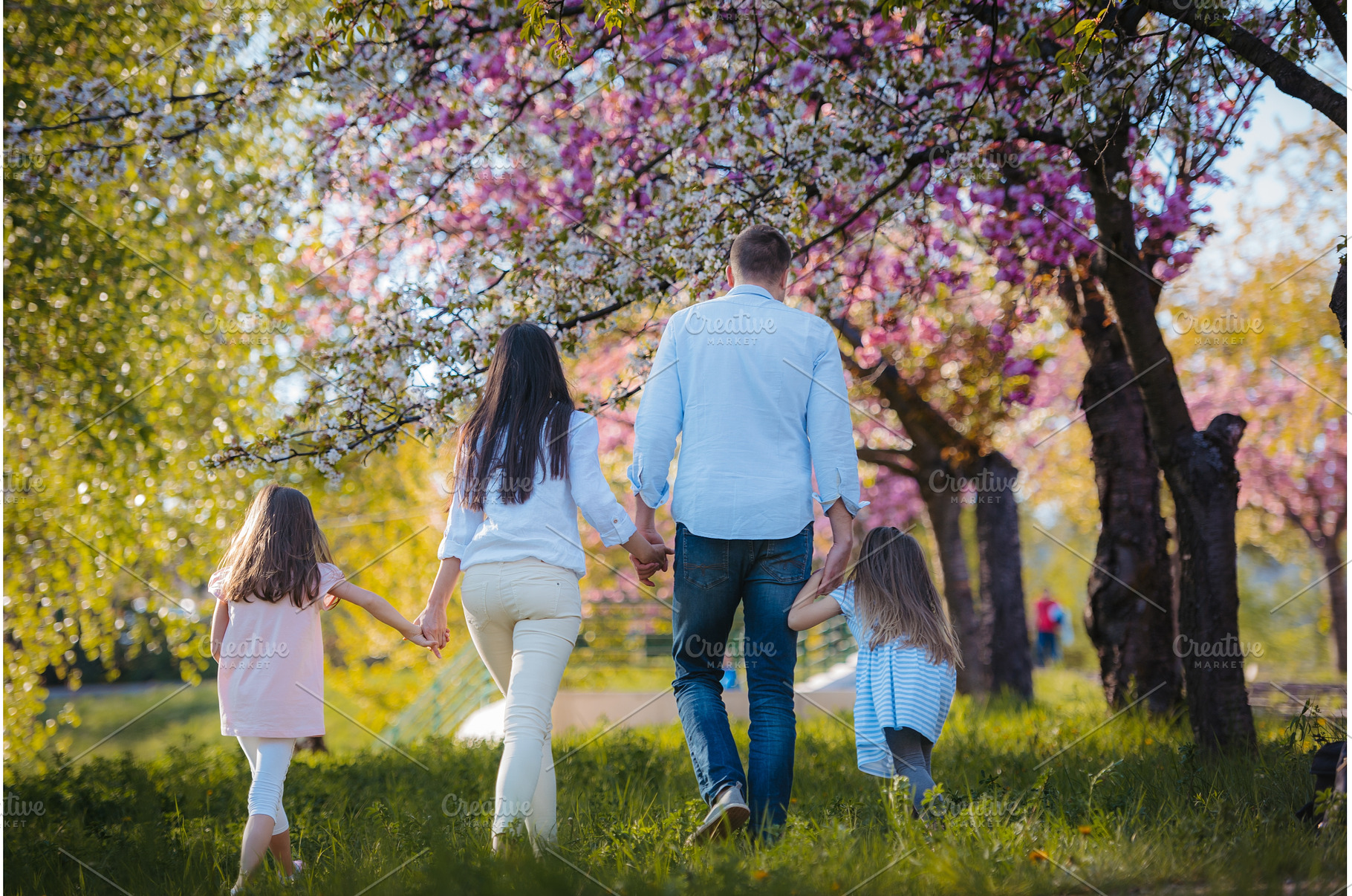 Rear view of family on walk in, a Person Photo by HalfPoint
