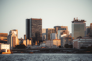 City skyline by river telephoto, an Architecture Photo by SkyNext