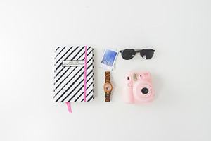 Flatlay sunglasses agenda instax containing hero header, hero image, and