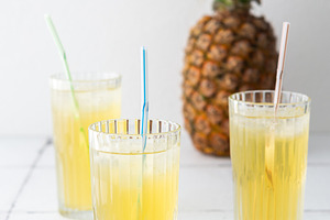 Pineapple juice in glasses, a Food & Drink Photo by Pundateam