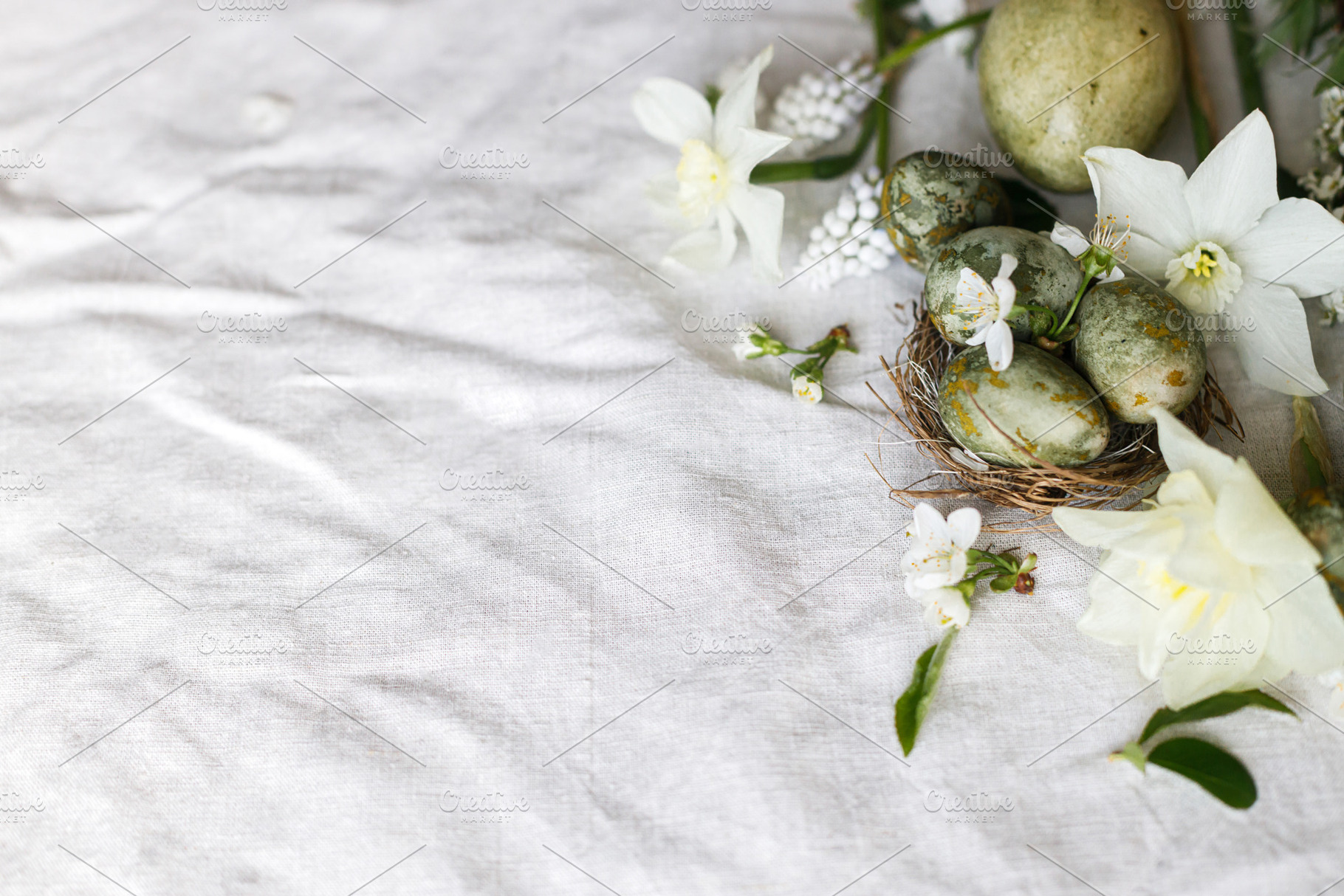 Happy Easter! Stylish natural dyed eggs and spring flowers on li, a Holiday Photo by Sonjachni